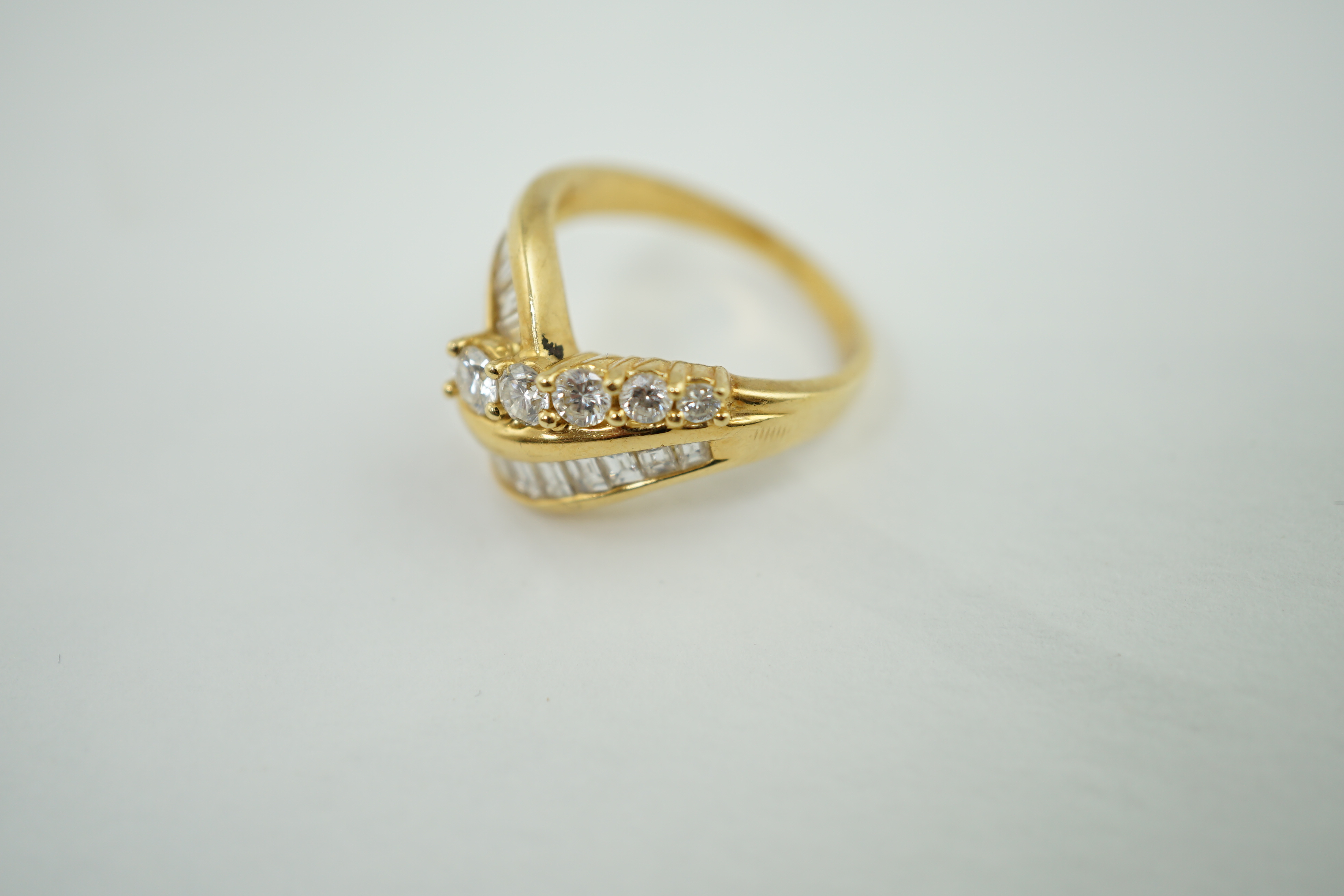 An 18k gold and diamond dress ring